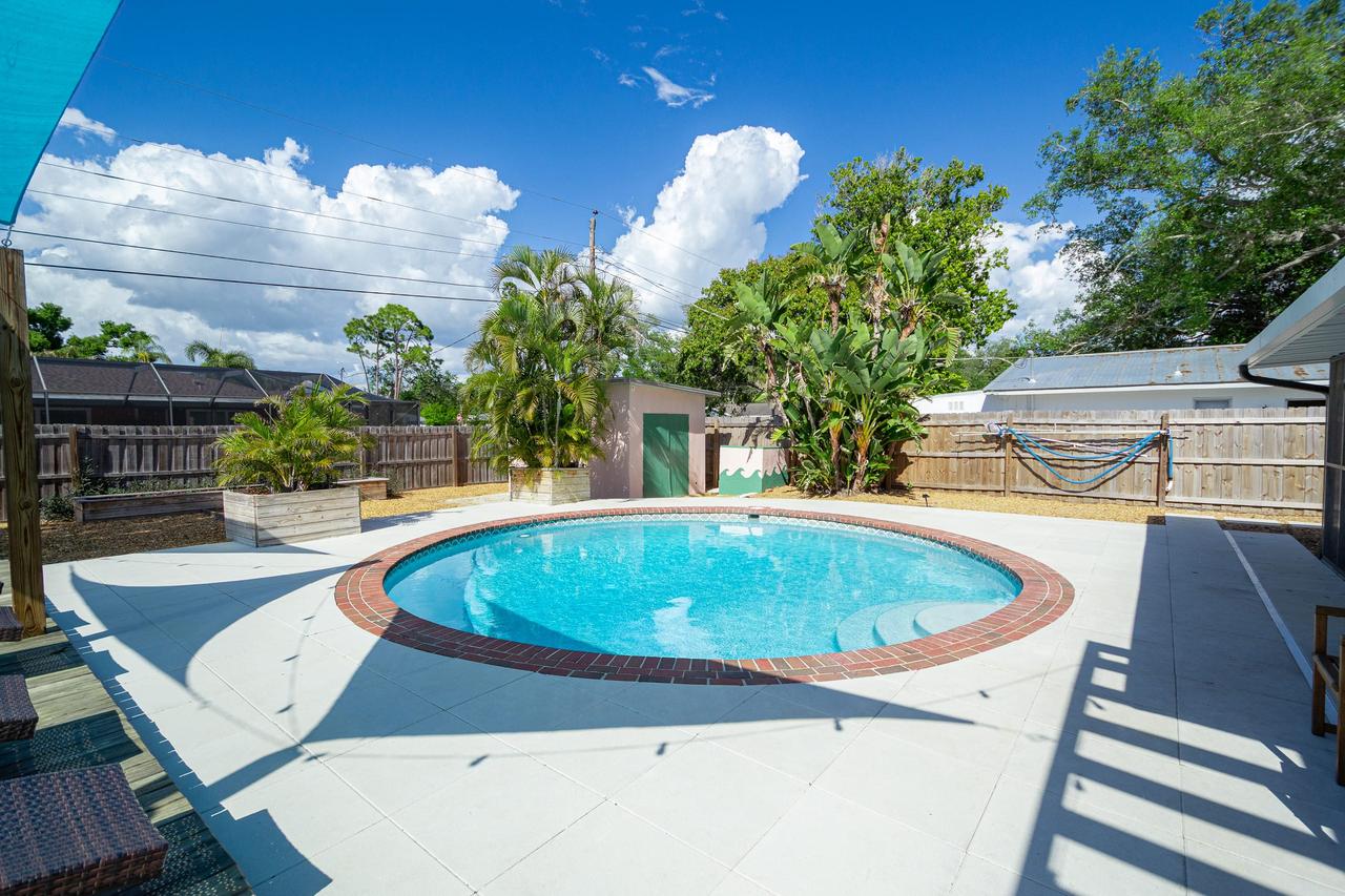 Private saltwater pool with turquoise shade sails at Siesta Tropical Escape, Sarasota FL
